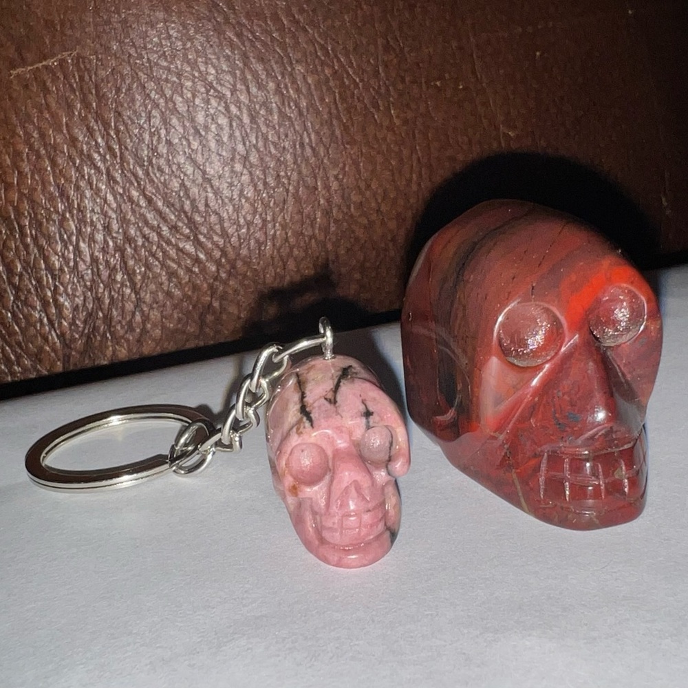 2 1/2 by 1 1/2 in. Red Tiger’s Eye Skull and Rhodonite Skull Keychain